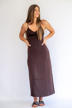 Load image into Gallery viewer, Woman wearing a brown slip dress against a white background
