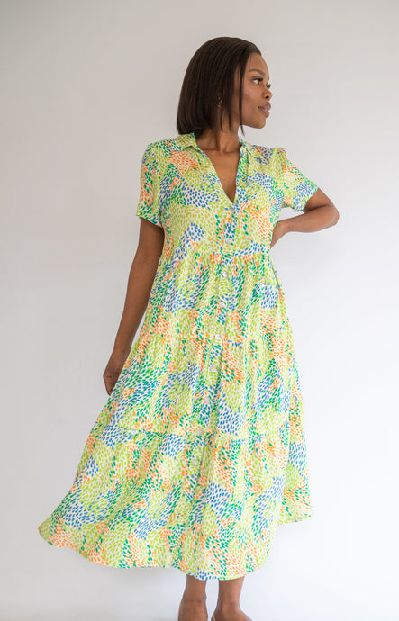 Woman wearing a polka dot dress on a white background